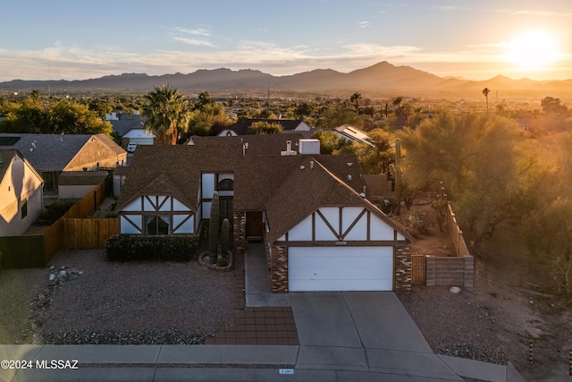 view of front of house with a mountain view and a garage