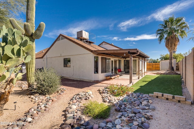 rear view of property with a patio area