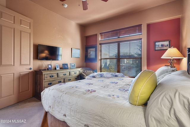 bedroom featuring ceiling fan and carpet floors