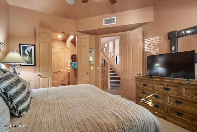 bedroom featuring ceiling fan, carpet floors, and a closet