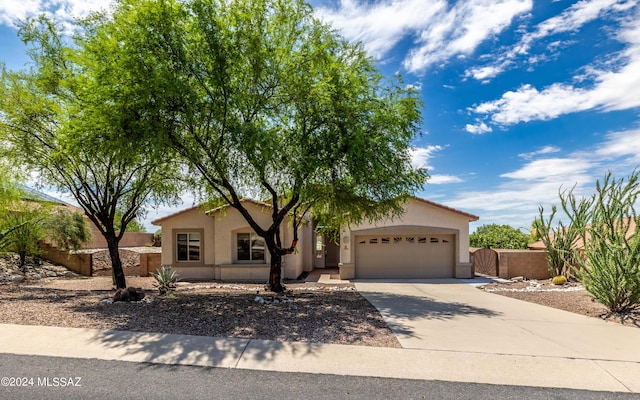 view of front of property with a garage