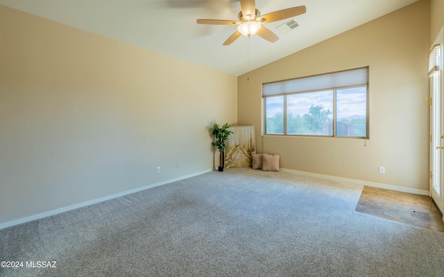 carpeted empty room featuring ceiling fan and vaulted ceiling