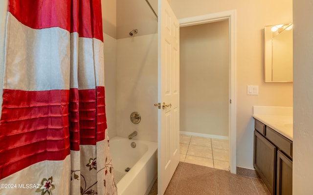 bathroom featuring tile patterned flooring, vanity, and shower / tub combo with curtain