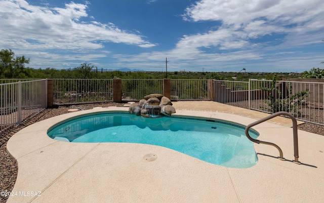 view of swimming pool featuring a patio area