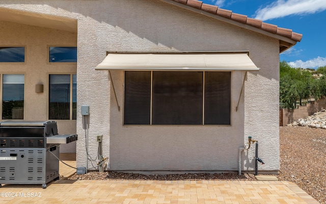 rear view of property with a patio