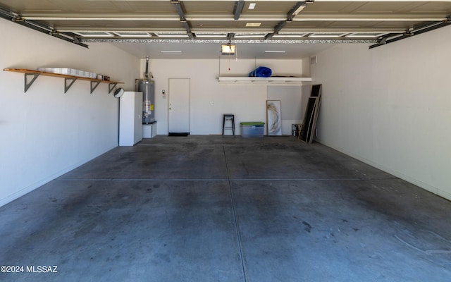 garage with water heater and a garage door opener