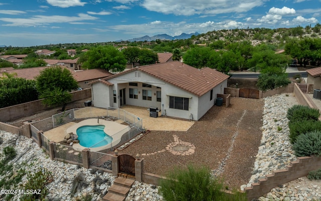 exterior space featuring a mountain view and a patio area