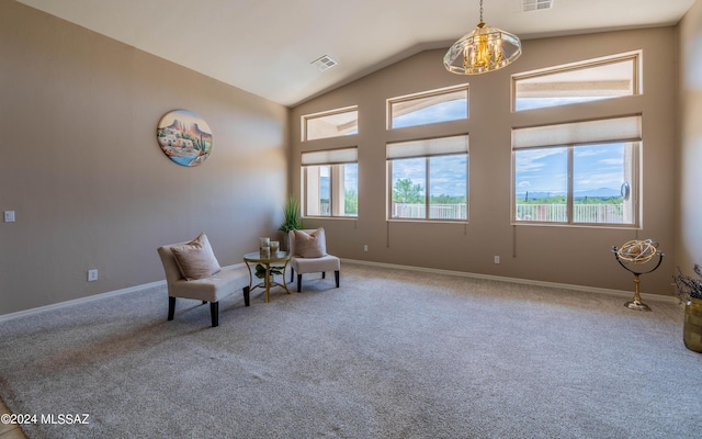 unfurnished room with carpet floors, lofted ceiling, and a notable chandelier