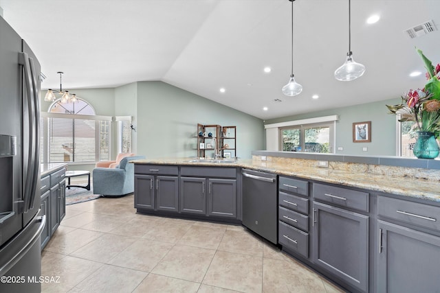 kitchen featuring light tile patterned floors, gray cabinetry, stainless steel appliances, visible vents, and vaulted ceiling