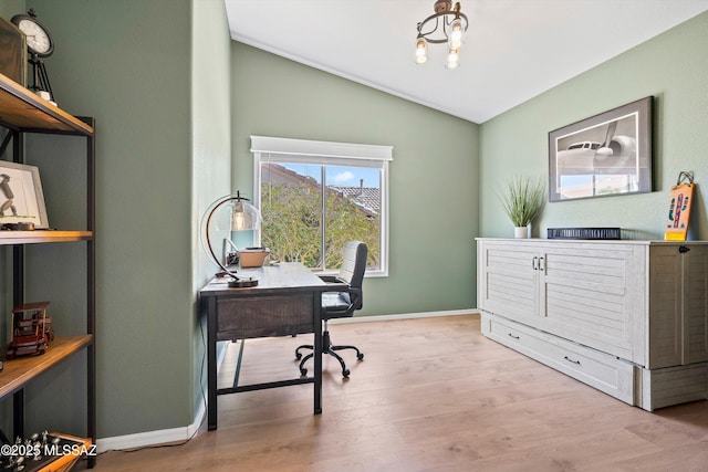 home office with a notable chandelier, vaulted ceiling, baseboards, and wood finished floors