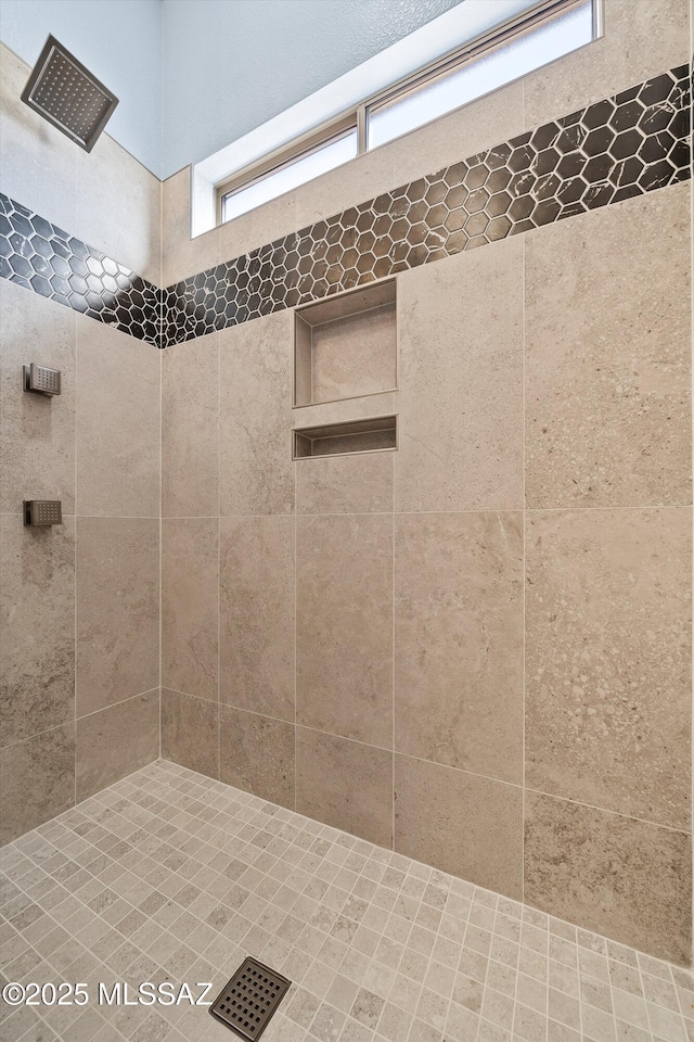 full bath with tiled shower