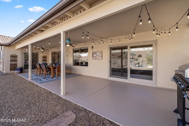 view of patio featuring ceiling fan