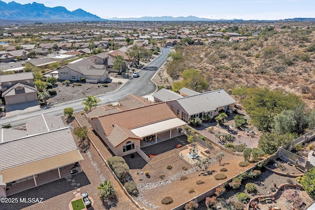 birds eye view of property with a residential view and a mountain view