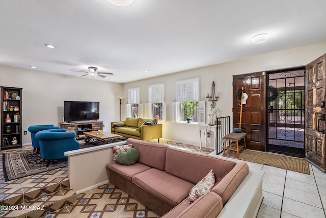 living room featuring ceiling fan and light tile patterned floors