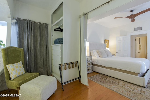 bedroom featuring wood-type flooring and ceiling fan