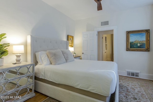 bedroom with ceiling fan and hardwood / wood-style flooring