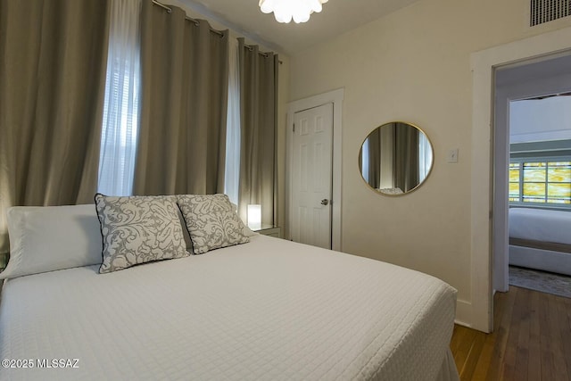 bedroom featuring dark hardwood / wood-style floors