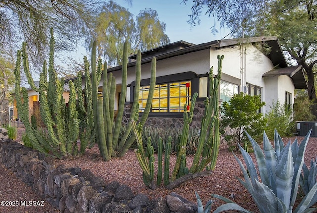 view of property exterior with central air condition unit