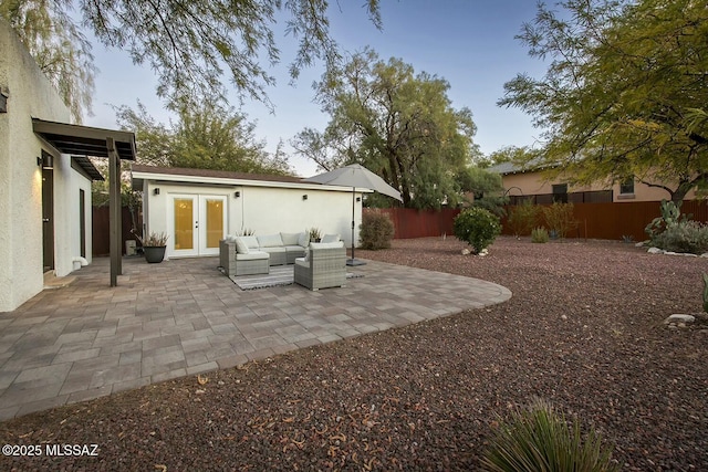 exterior space featuring an outdoor living space, a patio, and french doors