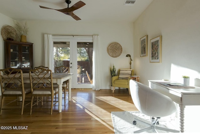 interior space featuring ceiling fan, french doors, and wood-type flooring