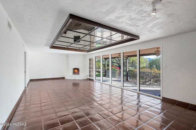 unfurnished living room featuring a fireplace