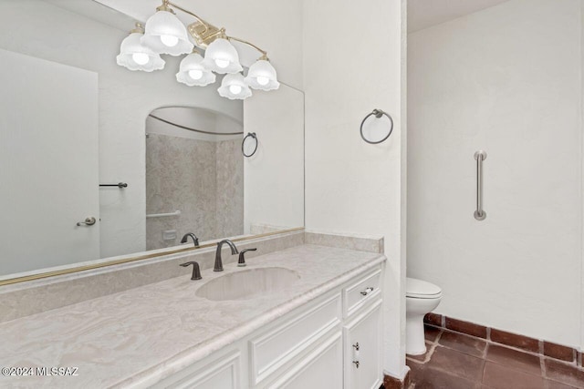 full bath with toilet, tile patterned flooring, and vanity