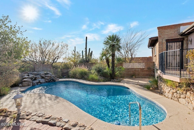 view of pool featuring a fenced backyard, a patio, and a fenced in pool