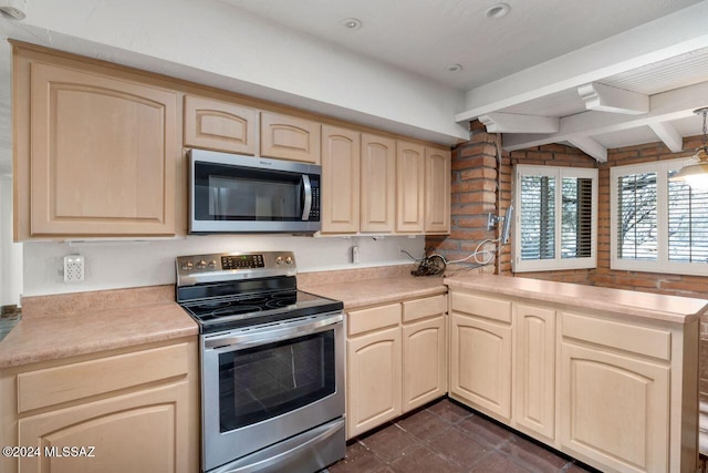 kitchen featuring beam ceiling, light brown cabinetry, kitchen peninsula, and appliances with stainless steel finishes