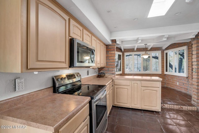 kitchen with decorative light fixtures, light brown cabinets, kitchen peninsula, and stainless steel appliances