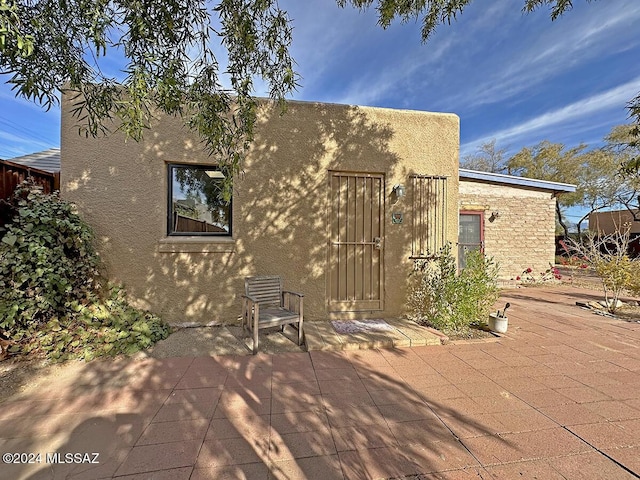 rear view of house with a patio