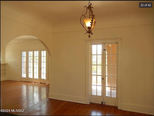 interior space with french doors, hardwood / wood-style flooring, and plenty of natural light