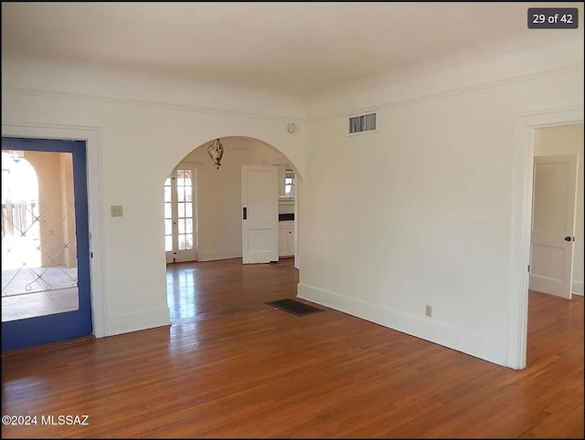 unfurnished room featuring dark hardwood / wood-style floors