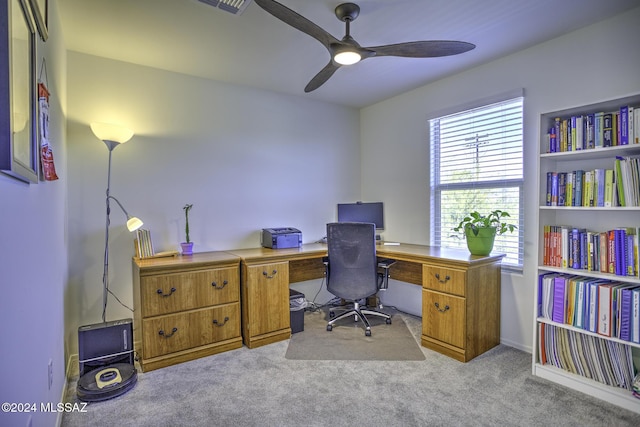 carpeted office with ceiling fan