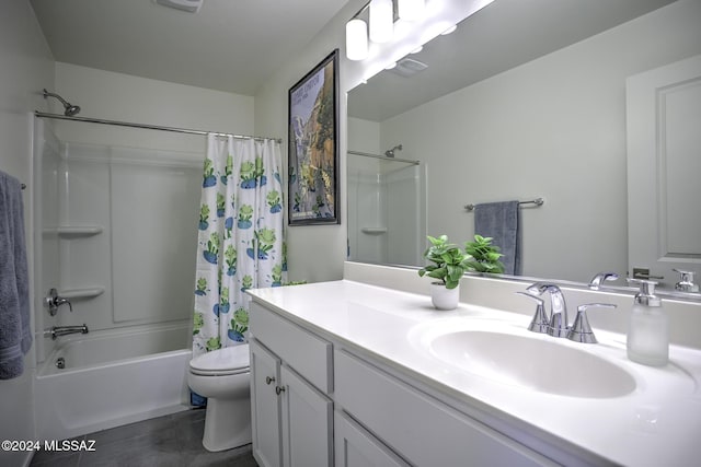 full bathroom with vanity, shower / tub combo, and toilet