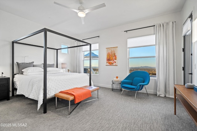 bedroom with multiple windows, carpet, and ceiling fan