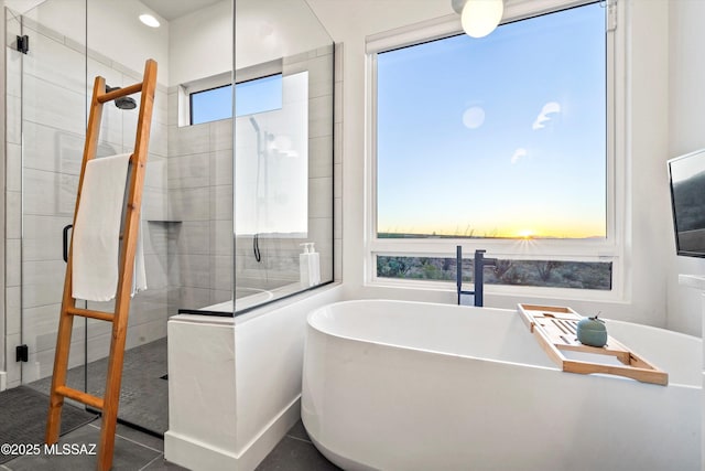 bathroom featuring separate shower and tub