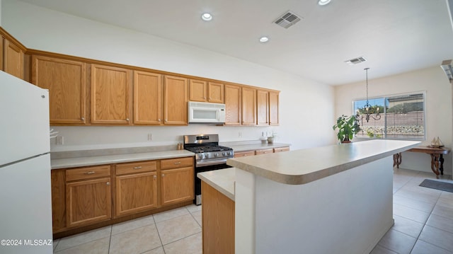 kitchen with decorative light fixtures, light tile patterned flooring, white appliances, a notable chandelier, and a kitchen island