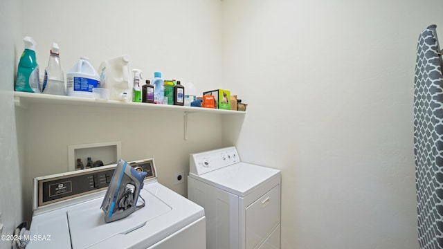 laundry room featuring washer and clothes dryer