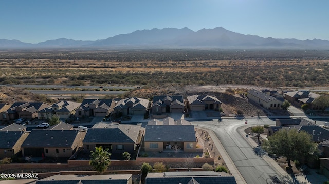 birds eye view of property with a mountain view