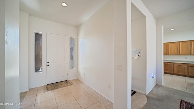 foyer entrance featuring light tile patterned floors