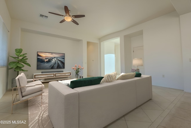 tiled living room featuring ceiling fan