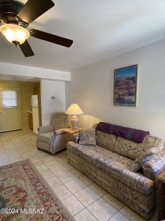 living room with ceiling fan and light tile patterned floors