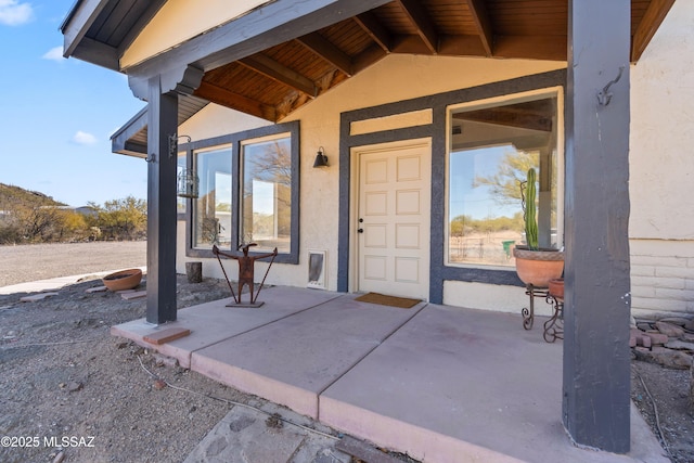 property entrance with a patio area