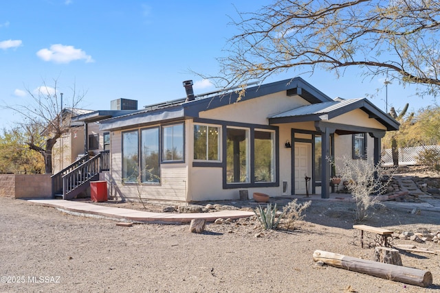 view of front of home featuring central air condition unit