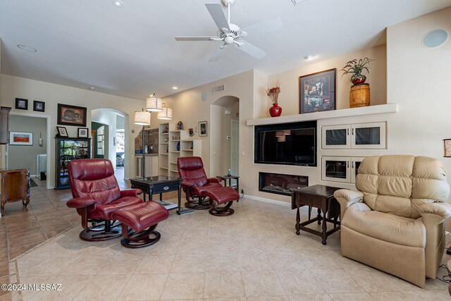 tiled living room featuring ceiling fan