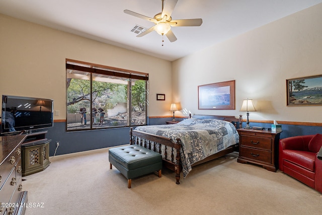 bedroom featuring light carpet, ceiling fan, and visible vents