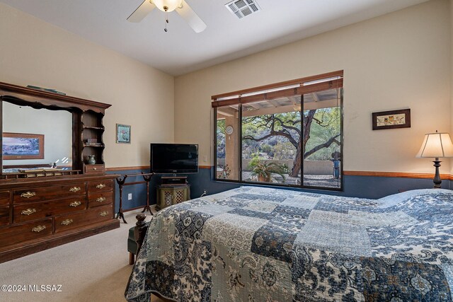 bedroom with light colored carpet and ceiling fan