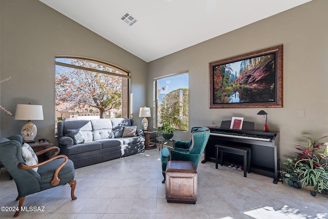 tiled living room with lofted ceiling