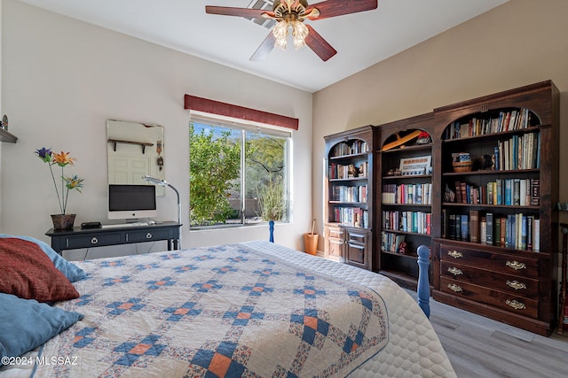 bedroom featuring ceiling fan and wood finished floors