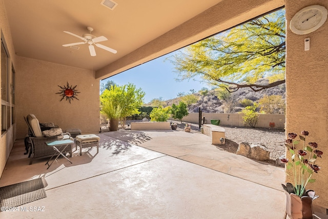 view of patio / terrace with ceiling fan, visible vents, and a fenced backyard